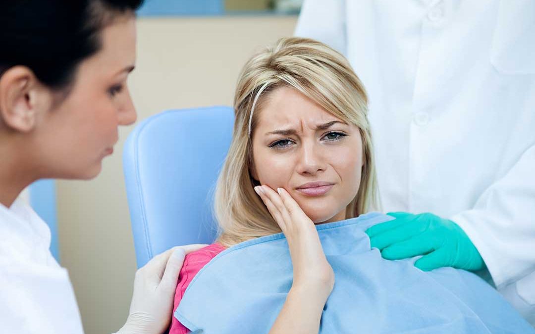 patient in pain root canal boca raton